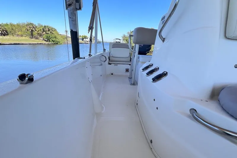 Slide: The Image of 2016 NauticStar 2110 Sport boat interior with seating and water view. - 4