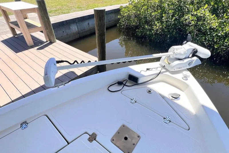 Slide: The Image of 2016 NauticStar 2110 Sport boat with trolling motor at dockside. - 7