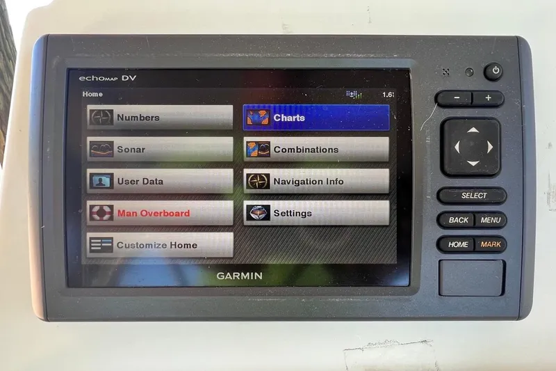 Slide: The Image of Garmin echomap DV display on 2016 NauticStar 2110 Sport boat, showing navigation options. - 9