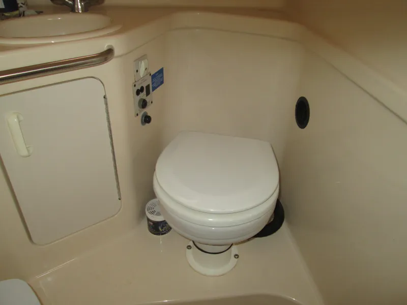 Slide: The Image of 1996 Sea Ray 290 Sundancer bathroom with toilet. - 13