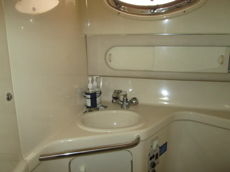 Slide: The Image of Interior of 1996 Sea Ray 290 Sundancer, bathroom with sink. - 14