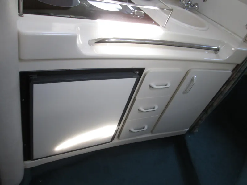 Slide: The Image of Galley in a 1996 Sea Ray 290 Sundancer yacht. - 16