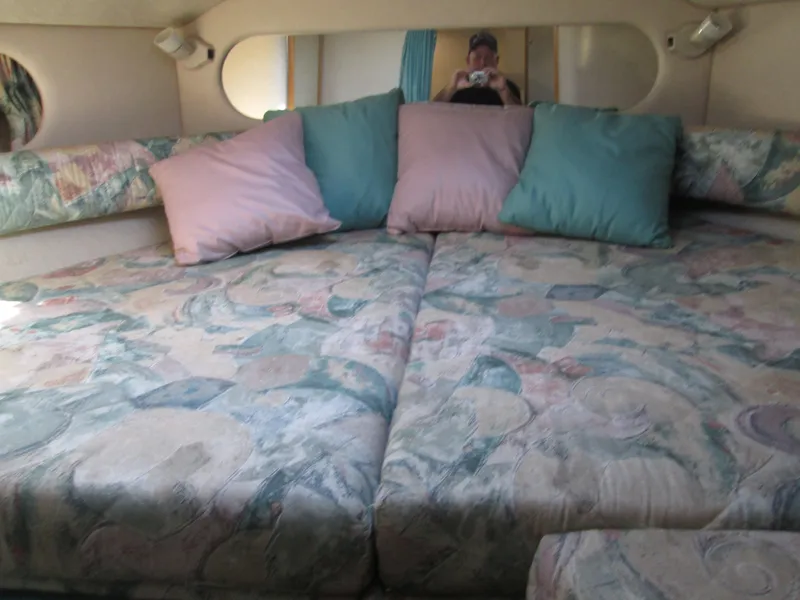 Slide: The Image of Interior of 1996 Sea Ray 290 Sundancer with cozy bed. - 20