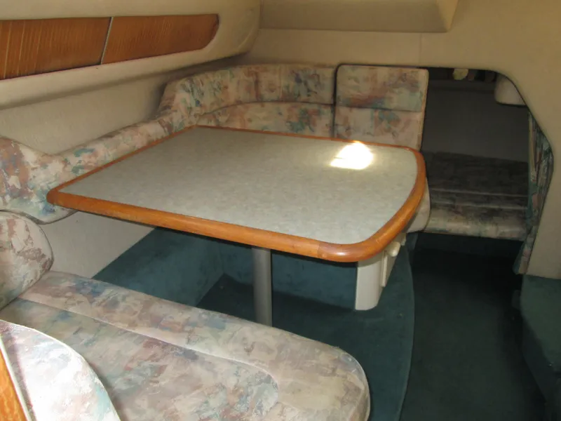 Slide: The Image of Interior of 1996 Sea Ray 290 Sundancer with dining table. - 23