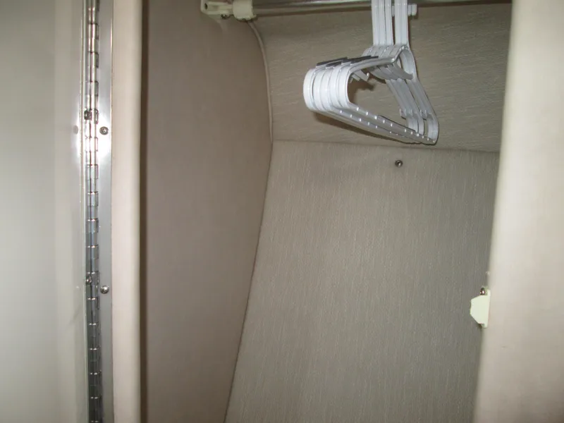 Slide: The Image of Interior of a 1996 Sea Ray 290 Sundancer with hangers. - 25