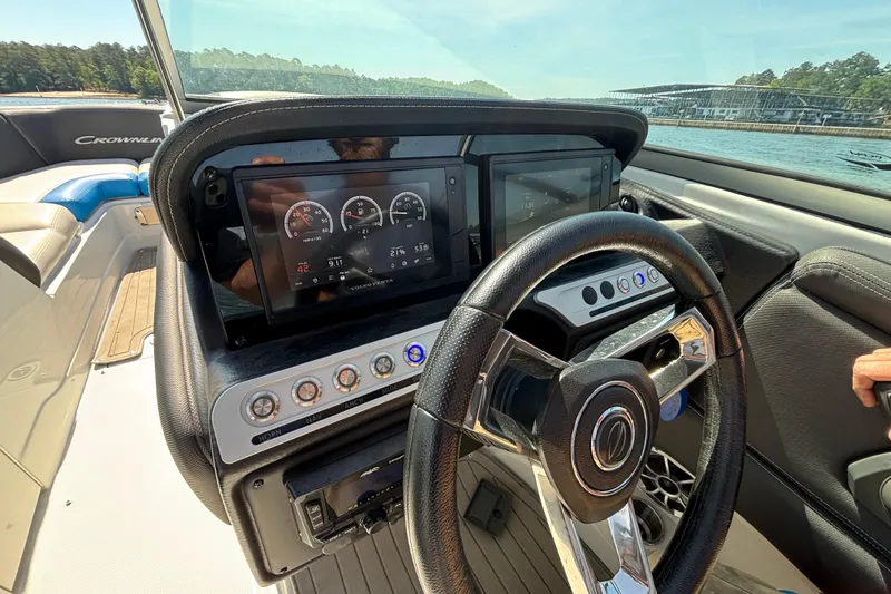 Slide: The Image of Steering console of 2022 Crownline 265 SS SURF boat with digital displays and controls. - 7