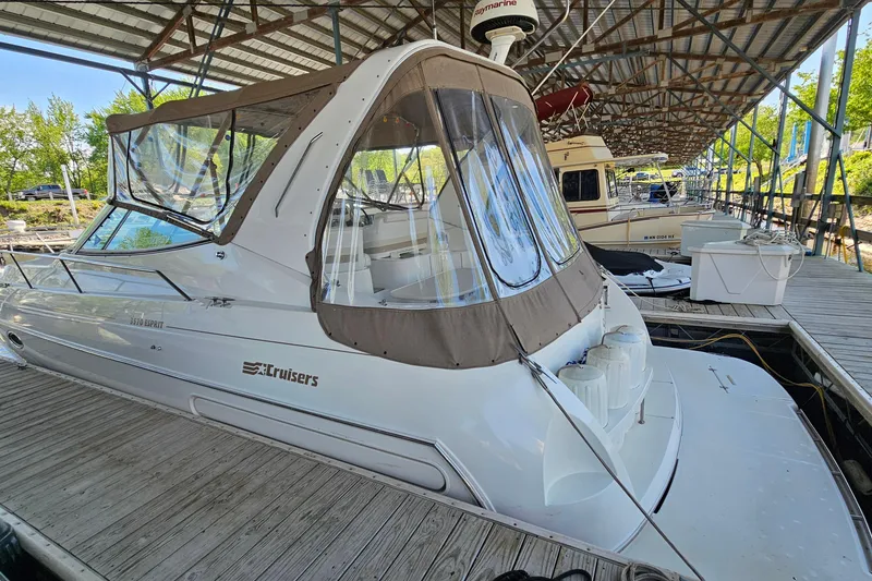 The Image of 1996 Cruisers Yachts 3570 Esprit docked under a covered marina. - 1