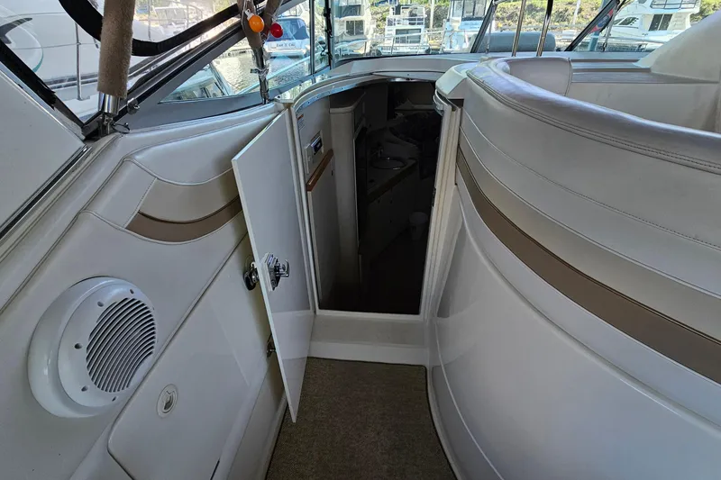 Slide: The Image of Interior view of 1996 Cruisers Yachts 3570 Esprit, featuring open cabin door and seating area. - 17