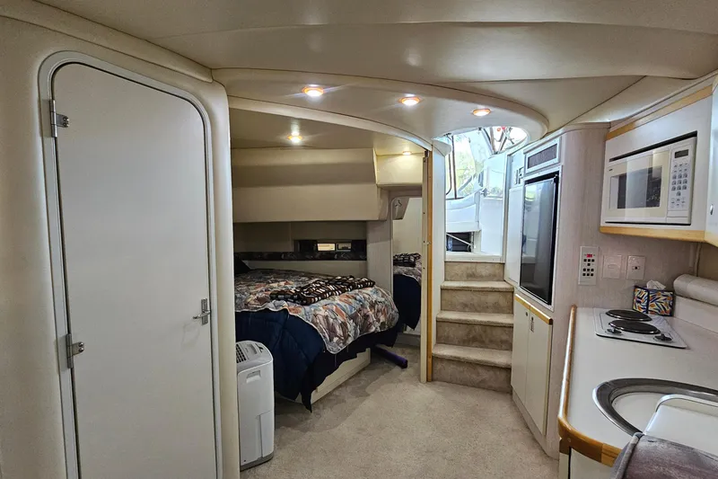 Slide: The Image of Interior of 1996 Cruisers Yachts 3570 Esprit with kitchen and sleeping area. - 19
