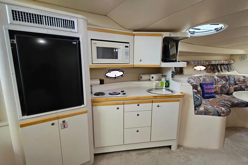 Slide: The Image of Interior of 1996 Cruisers Yachts 3570 Esprit with kitchenette and seating area. - 20