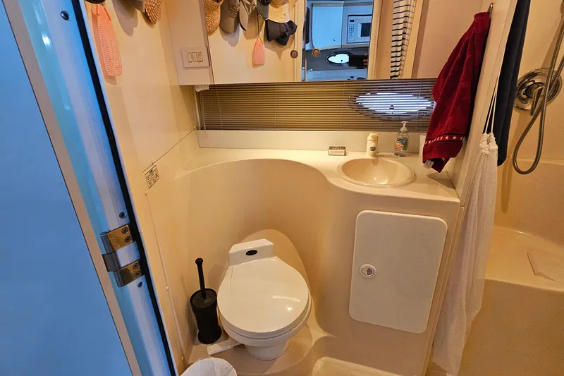 Slide: The Image of Bathroom interior of 1996 Cruisers Yachts 3570 Esprit with toilet, sink, and shower. - 25