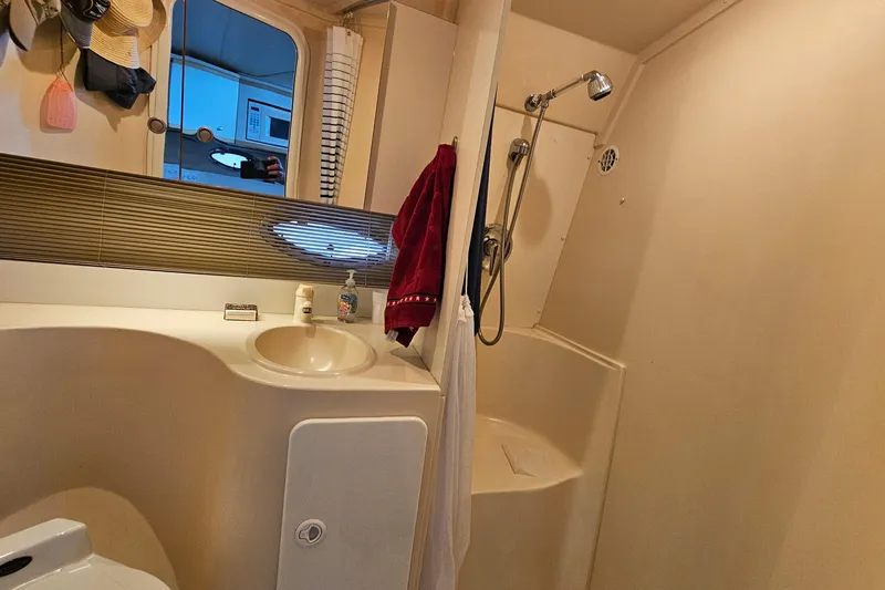Slide: The Image of Bathroom interior of 1996 Cruisers Yachts 3570 Esprit with sink and shower. - 26