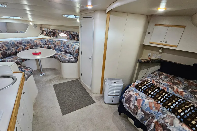 Slide: The Image of Interior of 1996 Cruisers Yachts 3570 Esprit with cozy seating and sleeping area. - 27