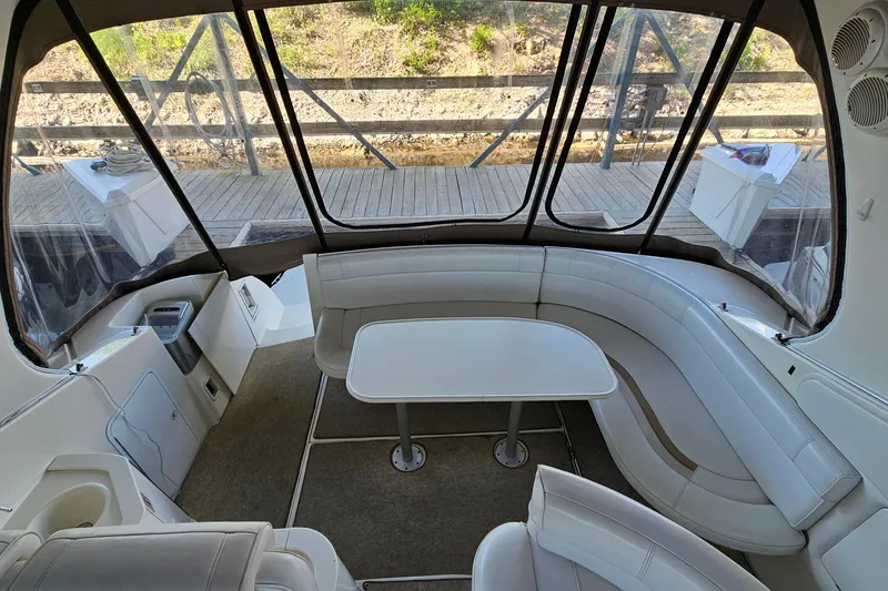 Slide: The Image of Interior of 1996 Cruisers Yachts 3570 Esprit with white seating and table. - 7