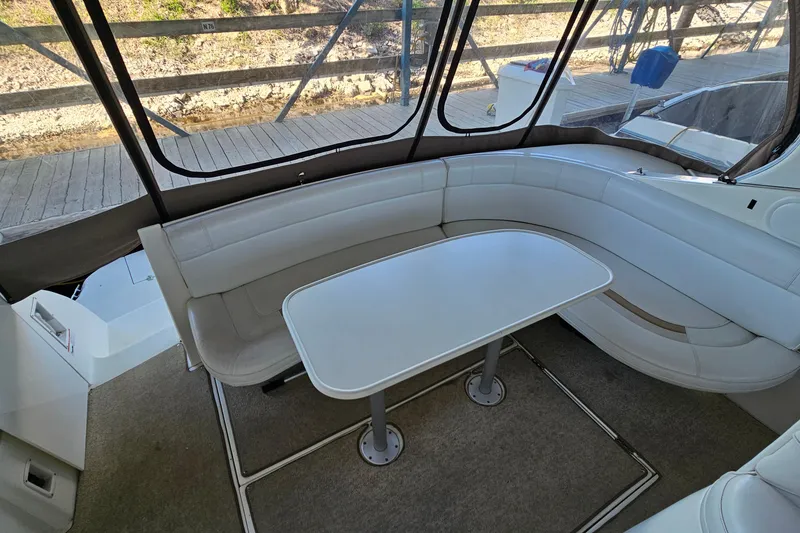 Slide: The Image of 1996 Cruisers Yachts 3570 Esprit interior with white seating and table. - 8