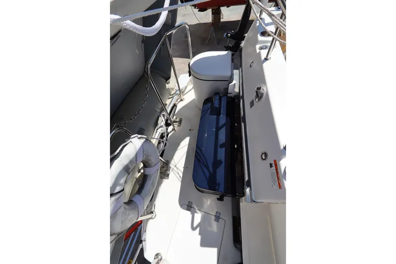 Slide: The Image of 2015 Ranger Tugs R-27 boat deck with seating and safety equipment. - 14