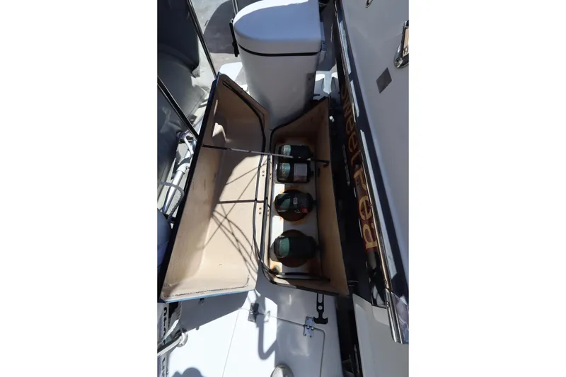 Slide: The Image of Storage compartment on 2015 Ranger Tugs R-27 boat with propane tanks. - 15