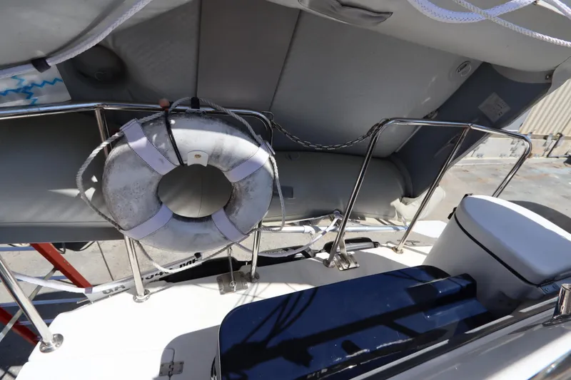 Slide: The Image of 2015 Ranger Tugs R-27 boat deck with life ring and railing. - 23