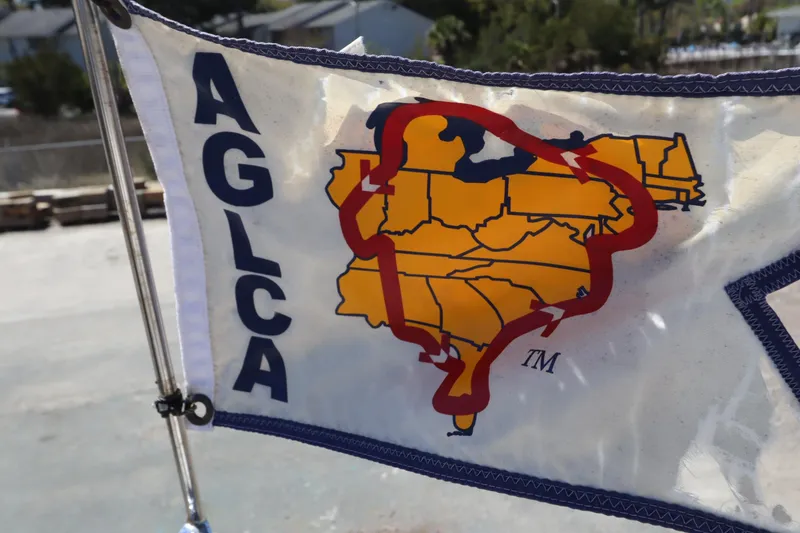 Slide: The Image of Flag displaying AGLCA logo on a 2015 Ranger Tugs R-27 boat. - 30