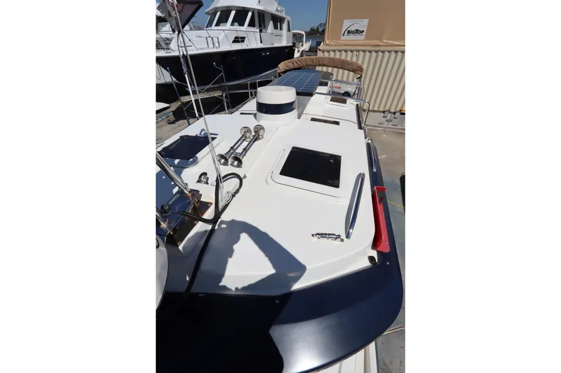 Slide: The Image of 2015 Ranger Tugs R-27 boat deck with solar panel and equipment in marina. - 37