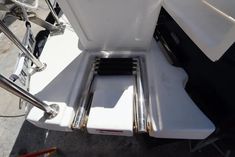 Slide: The Image of 2015 Ranger Tugs R-27 swim platform with stainless steel folding ladder. - 50