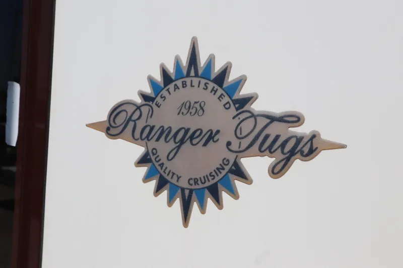 Slide: The Image of Ranger Tugs logo on a 2015 R-27 model, emphasizing quality cruising since 1958. - 57