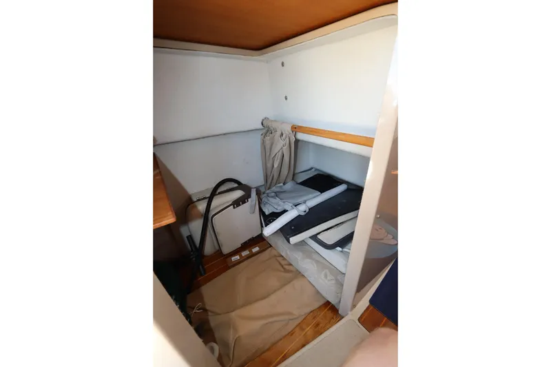 Slide: The Image of Interior storage space of 2015 Ranger Tugs R-27 boat with folded items. - 69