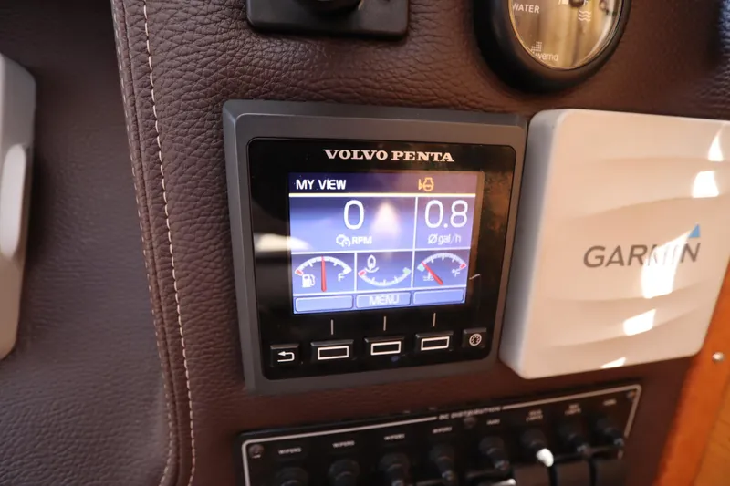 Slide: The Image of Volvo Penta display on 2015 Ranger Tugs R-27 dashboard with Garmin device. - 70