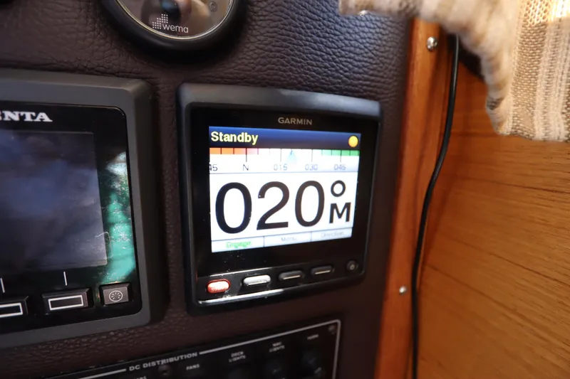 Slide: The Image of Garmin navigation display on 2015 Ranger Tugs R-27 boat, showing heading in standby mode. - 76