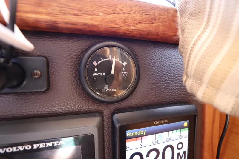 Slide: The Image of Dashboard of 2015 Ranger Tugs R-27 with water gauge and Garmin display. - 77