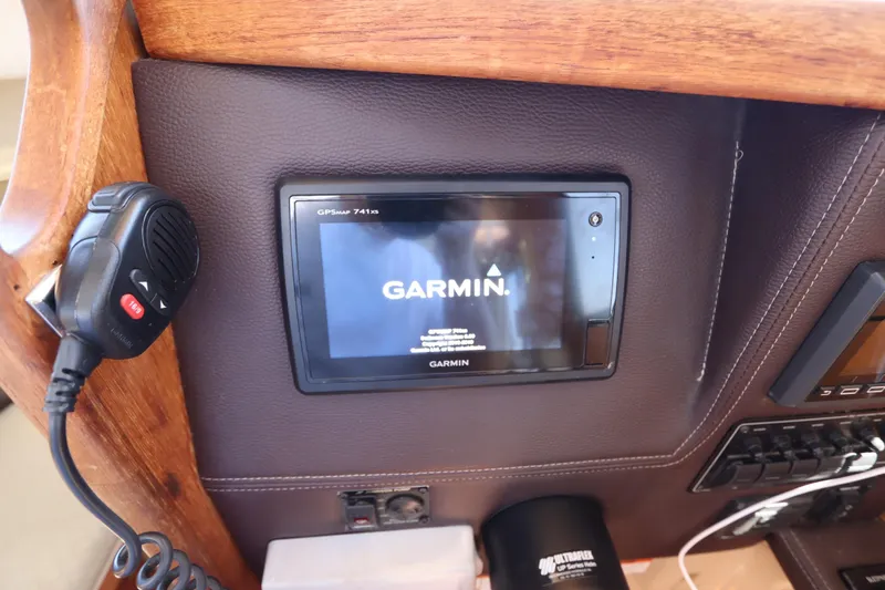 Slide: The Image of Garmin GPS display on 2015 Ranger Tugs R-27 boat dashboard with microphone. - 80
