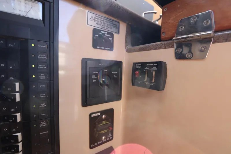 Slide: The Image of Electrical control panel on a 2015 Ranger Tugs R-27 boat interior. - 90