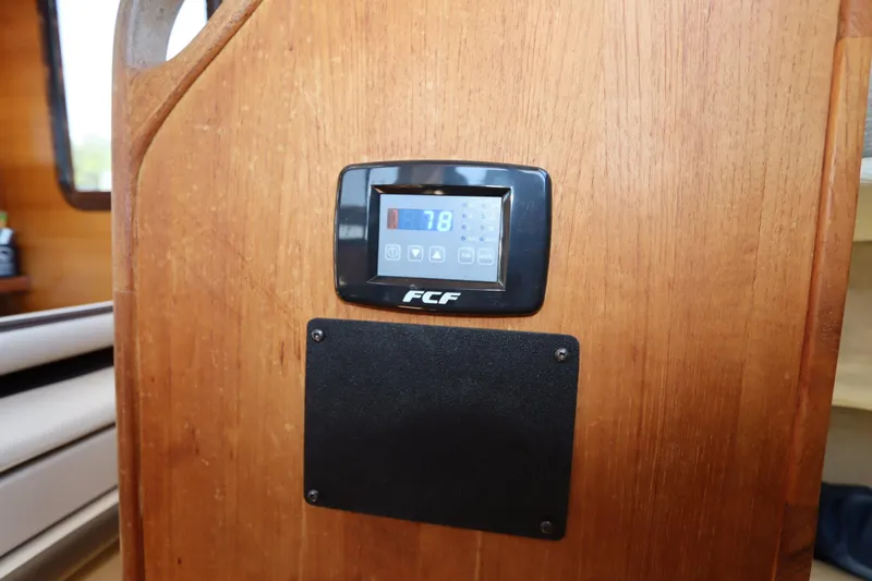Slide: The Image of Control panel on 2015 Ranger Tugs R-27 boat interior, displaying temperature settings. - 92