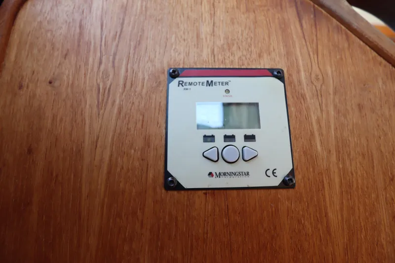 Slide: The Image of Remote meter on 2015 Ranger Tugs R-27 boat, mounted on wooden panel. - 93