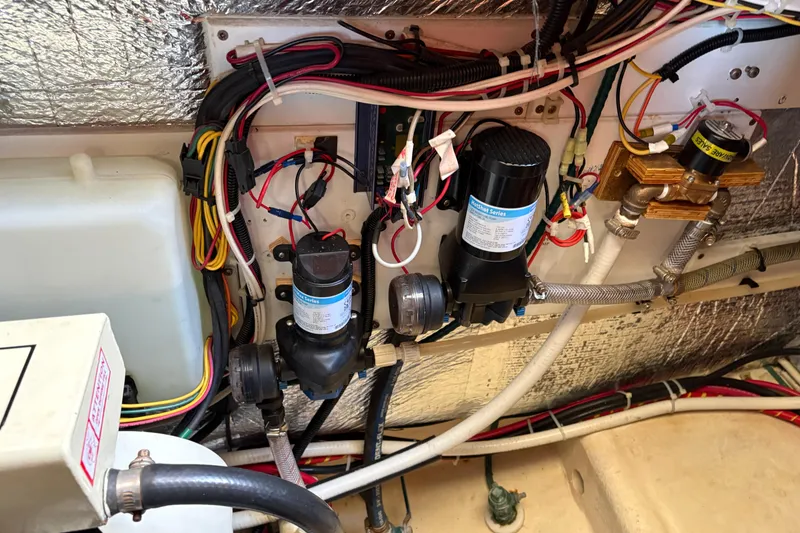 Slide: The Image of Engine room wiring and components of a 2004 Nordic Tug 32 boat. - 39