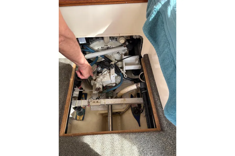 Slide: The Image of Engine compartment of a 2004 Nordic Tug 32 with visible mechanical components. - 40