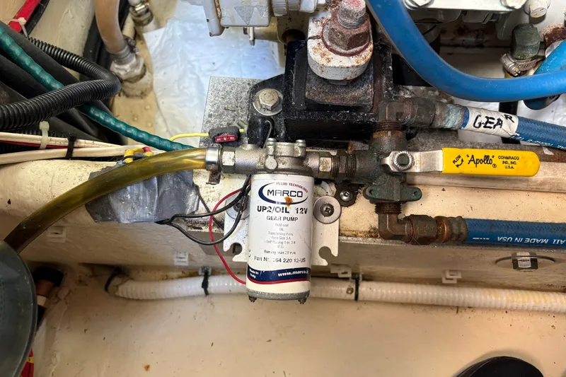 Slide: The Image of Engine compartment of a 2004 Nordic Tug 32 featuring a Marco gear pump. - 43
