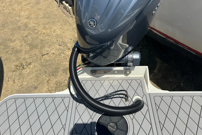 Slide: The Image of Outboard motor on 2026 Defiance Admiral 220 EX boat, featuring a sleek design and durable deck. - 13