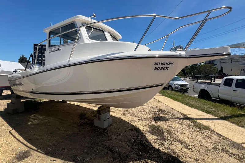 Slide: The Image of 2026 Defiance Admiral 220 EX boat on display, featuring "No Wood! No Rot!" slogan. - 7