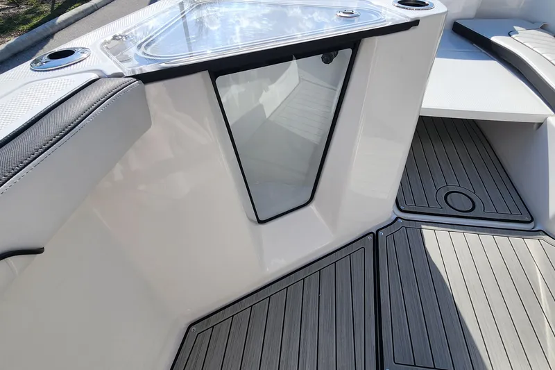 Slide: The Image of Interior view of 2022 Yamaha 255 FSH Sport E boat, featuring sleek design and flooring. - 21