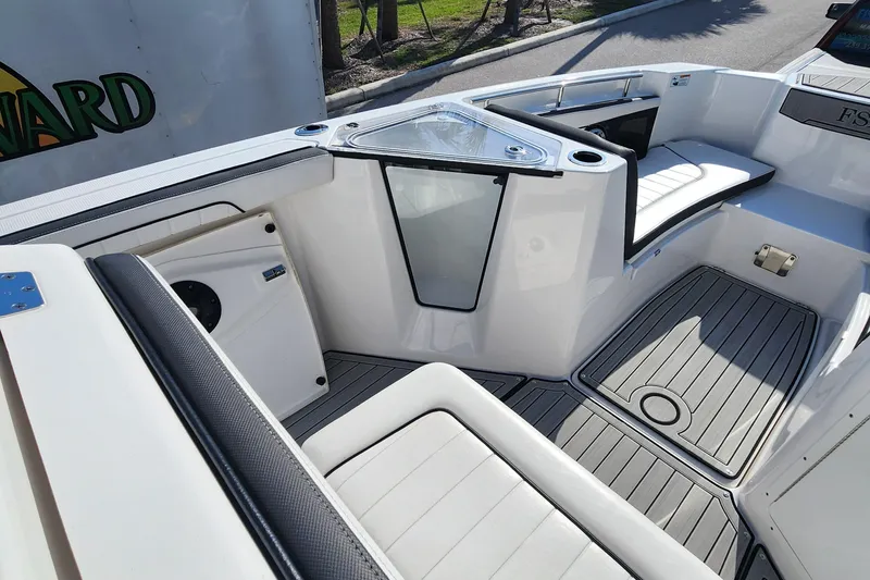 Slide: The Image of 2022 Yamaha 255 FSH Sport E boat interior with seating and deck details. - 29