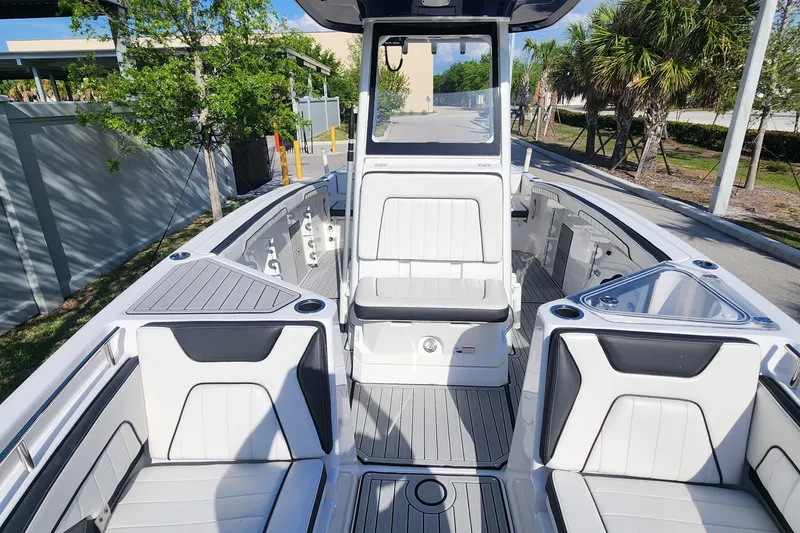 Slide: The Image of 2022 Yamaha 255 FSH Sport E boat interior with sleek seating and modern design. - 32