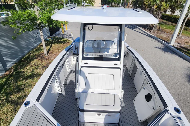 Slide: The Image of 2022 Yamaha 255 FSH Sport E boat, featuring sleek design and spacious seating. - 35