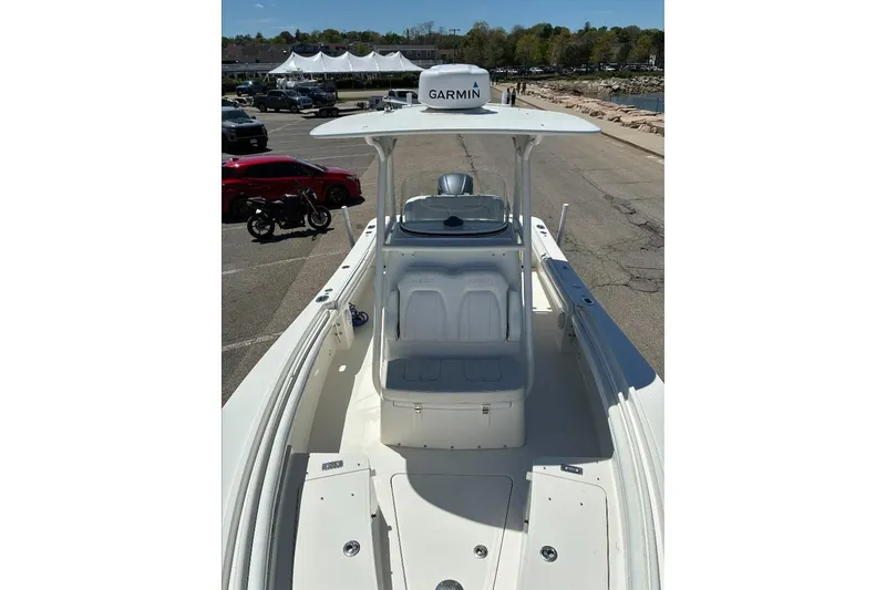 Slide: The Image of 2019 Regulator 23 boat with Garmin equipment, docked in a sunny marina. - 11