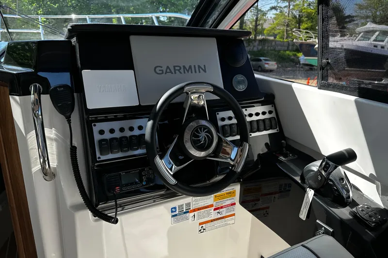 Slide: The Image of 2026 Solara S-250 Coupe helm with Garmin navigation and Yamaha controls. - 11