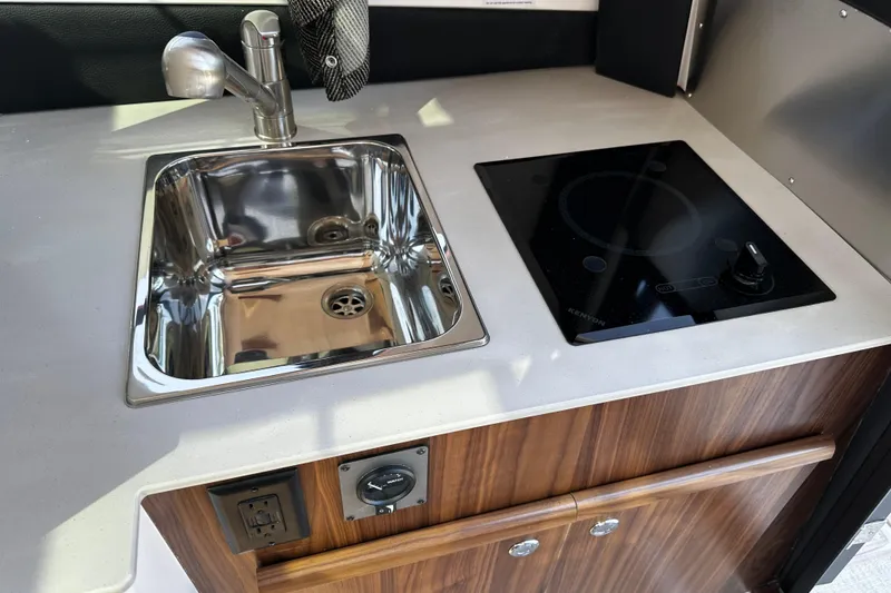 Slide: The Image of Modern kitchenette in 2026 Solara S-250 Coupe with sink and induction cooktop. - 14