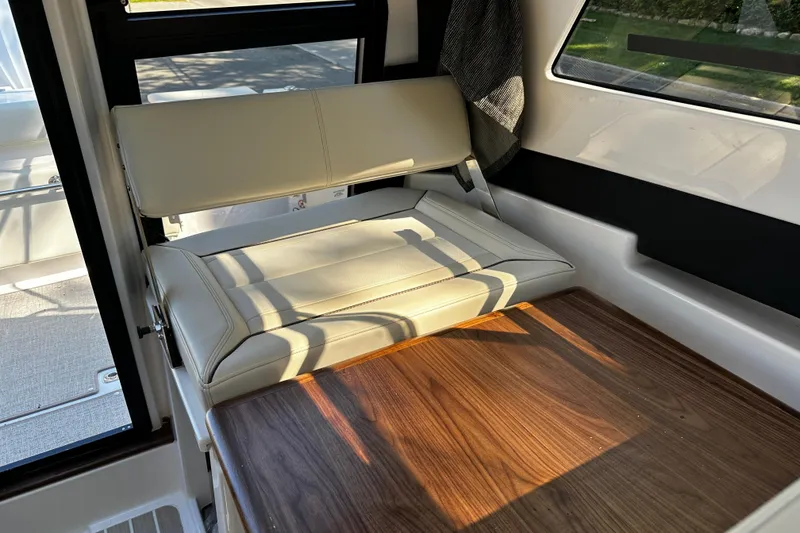 Slide: The Image of Luxurious interior of 2026 Solara S-250 Coupe with beige seating and wooden accents. - 15