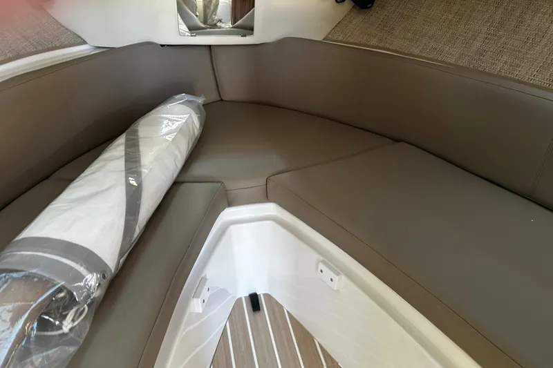 Slide: The Image of Interior of 2026 Solara S-250 Coupe with brown seating and packaged sail. - 19