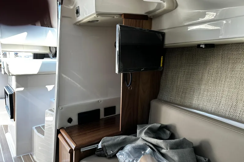 Slide: The Image of Interior of 2026 Solara S-250 Coupe featuring a compact entertainment setup. - 20