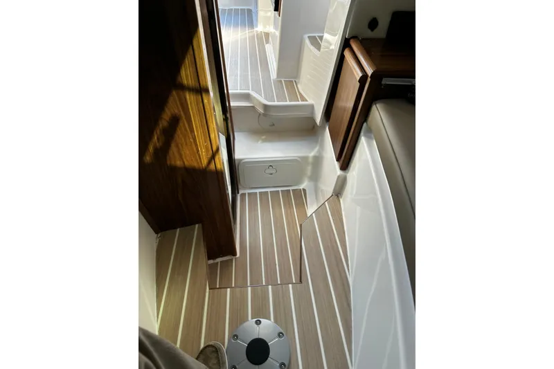 Slide: The Image of Interior view of 2026 Solara S-250 Coupe, featuring sleek wooden flooring and modern design. - 21